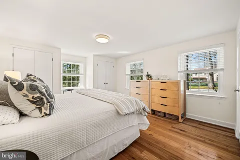 a bedroom with a bed and a closet