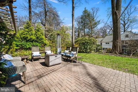a view of a chairs and table in the patio
