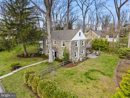 a view of a house with a yard porch and sitting area