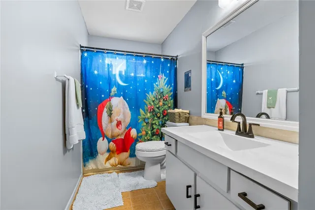 a living room with furniture a sink and a large mirror