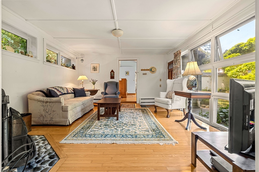 21 Preston Beach Road Marblehead, MA 01945 - Photo 6 of 34 a living room with fireplace furniture and a rug