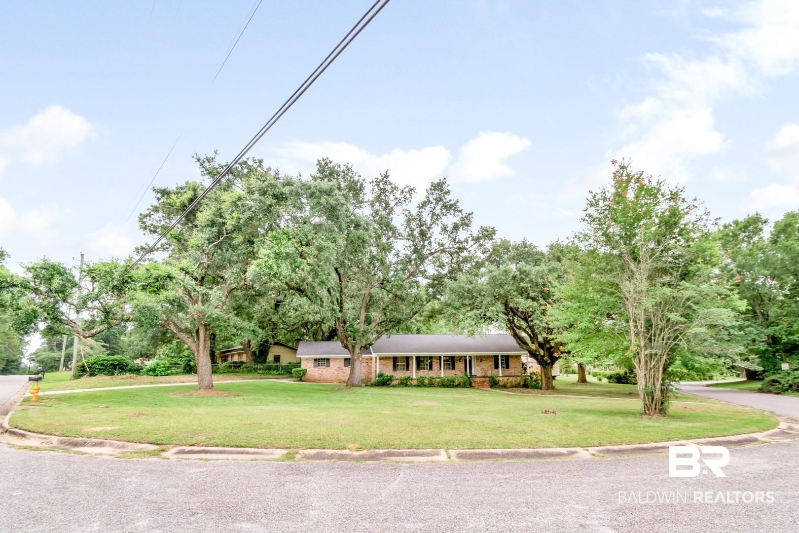 5217 Perin Road Mobile, AL 36693 - Photo 43 of 45 Brick exterior residence with a covered porch and substantial front lawn