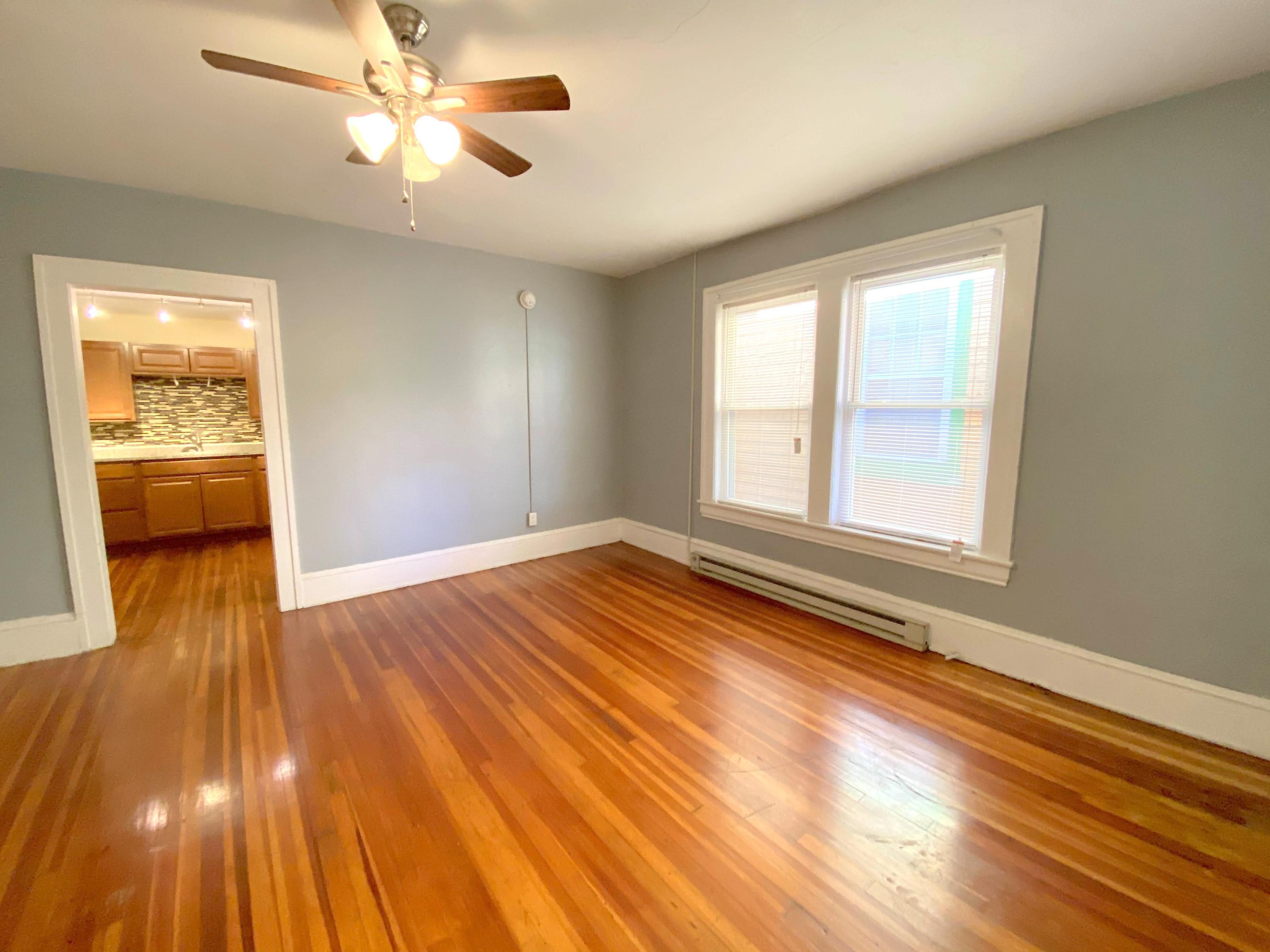 1306 Patterson Avenue Southwest, Unit 3 Roanoke, VA 24016 - Photo 12 of 28 a view of empty room with wooden floor and fan