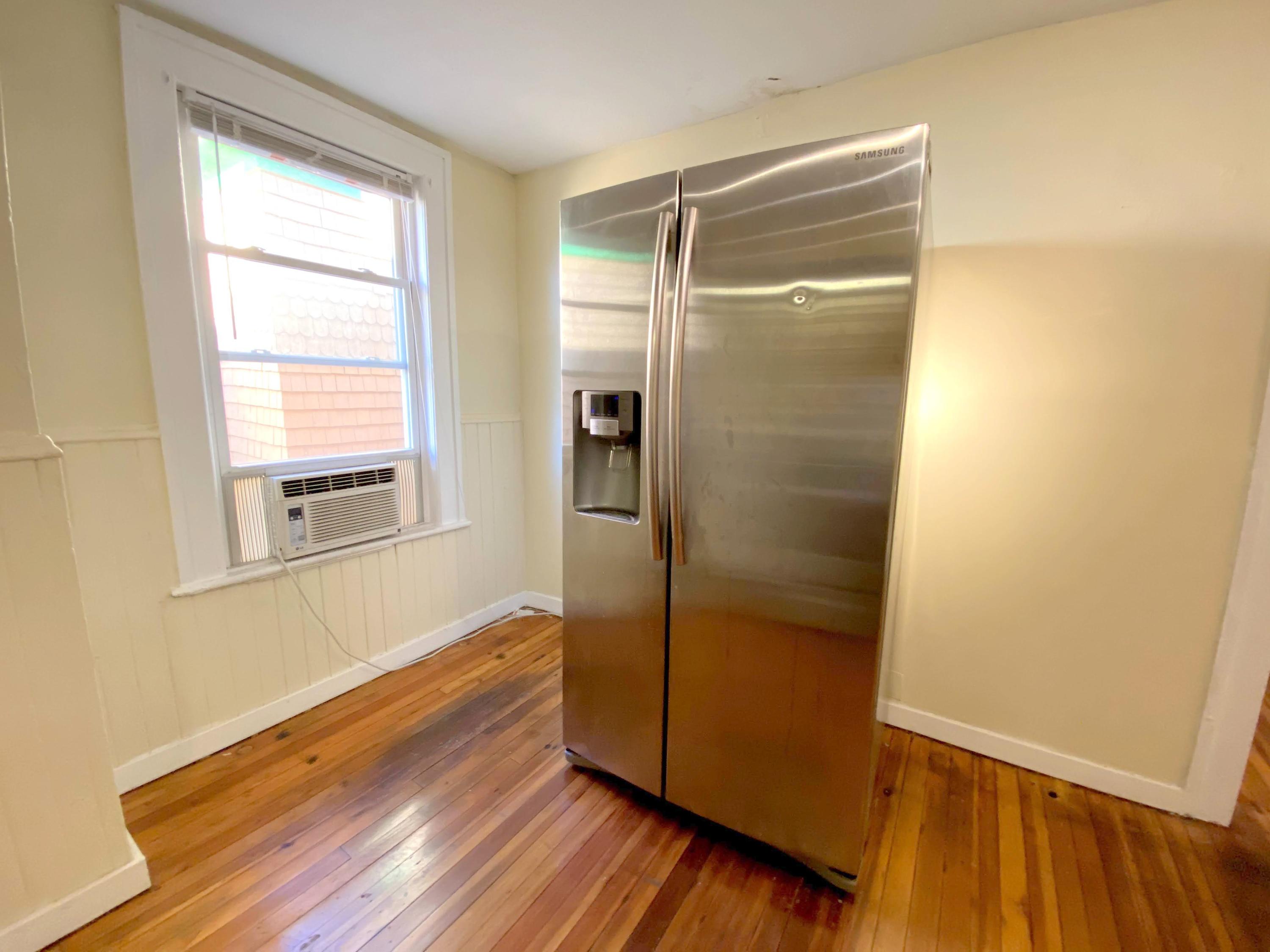 1306 Patterson Avenue Southwest, Unit 3 Roanoke, VA 24016 - Photo 16 of 28 a bathroom with a glass door shower and a window