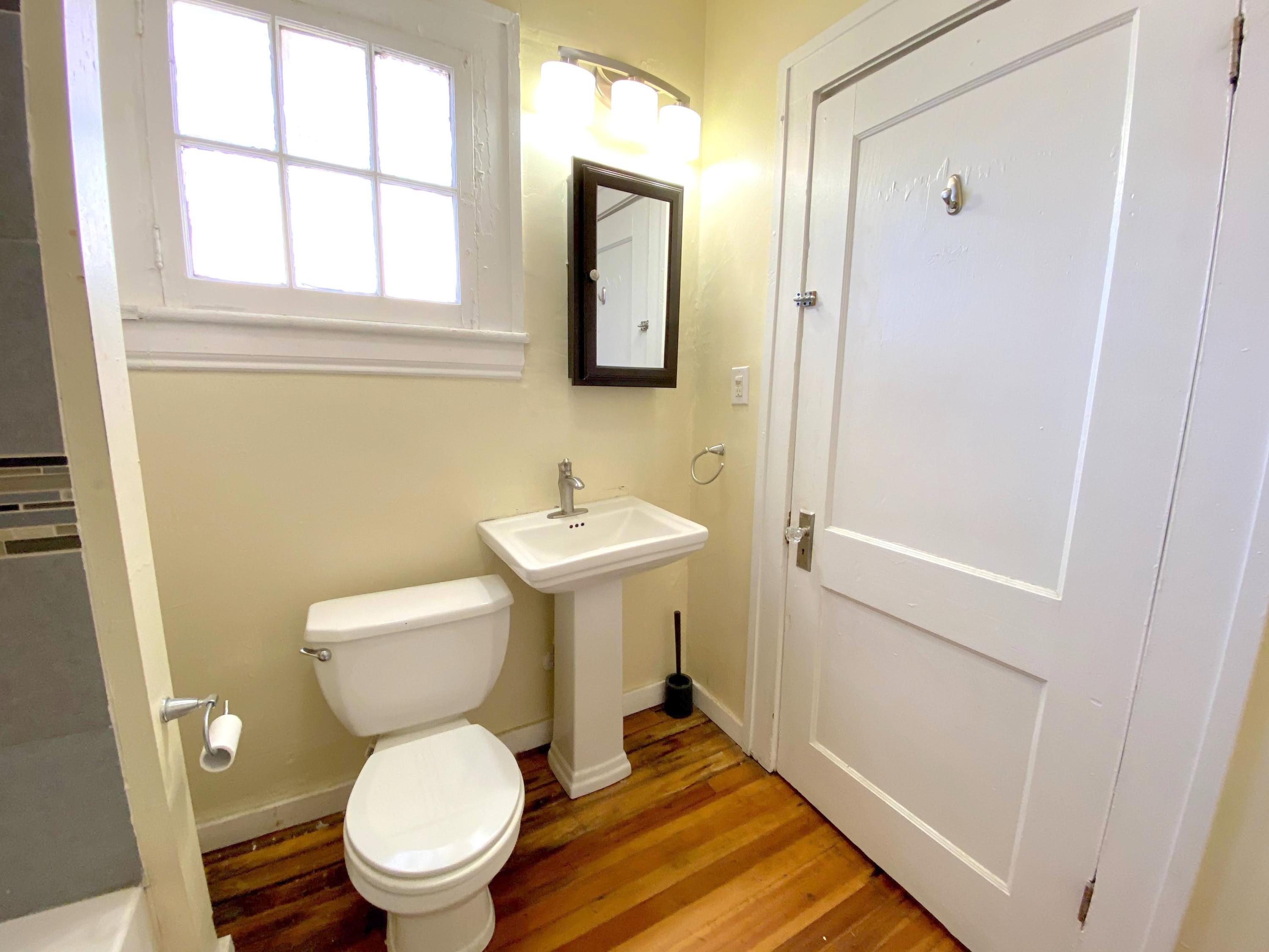 1306 Patterson Avenue Southwest, Unit 3 Roanoke, VA 24016 - Photo 17 of 28 a white toilet sitting next to a bathroom sink