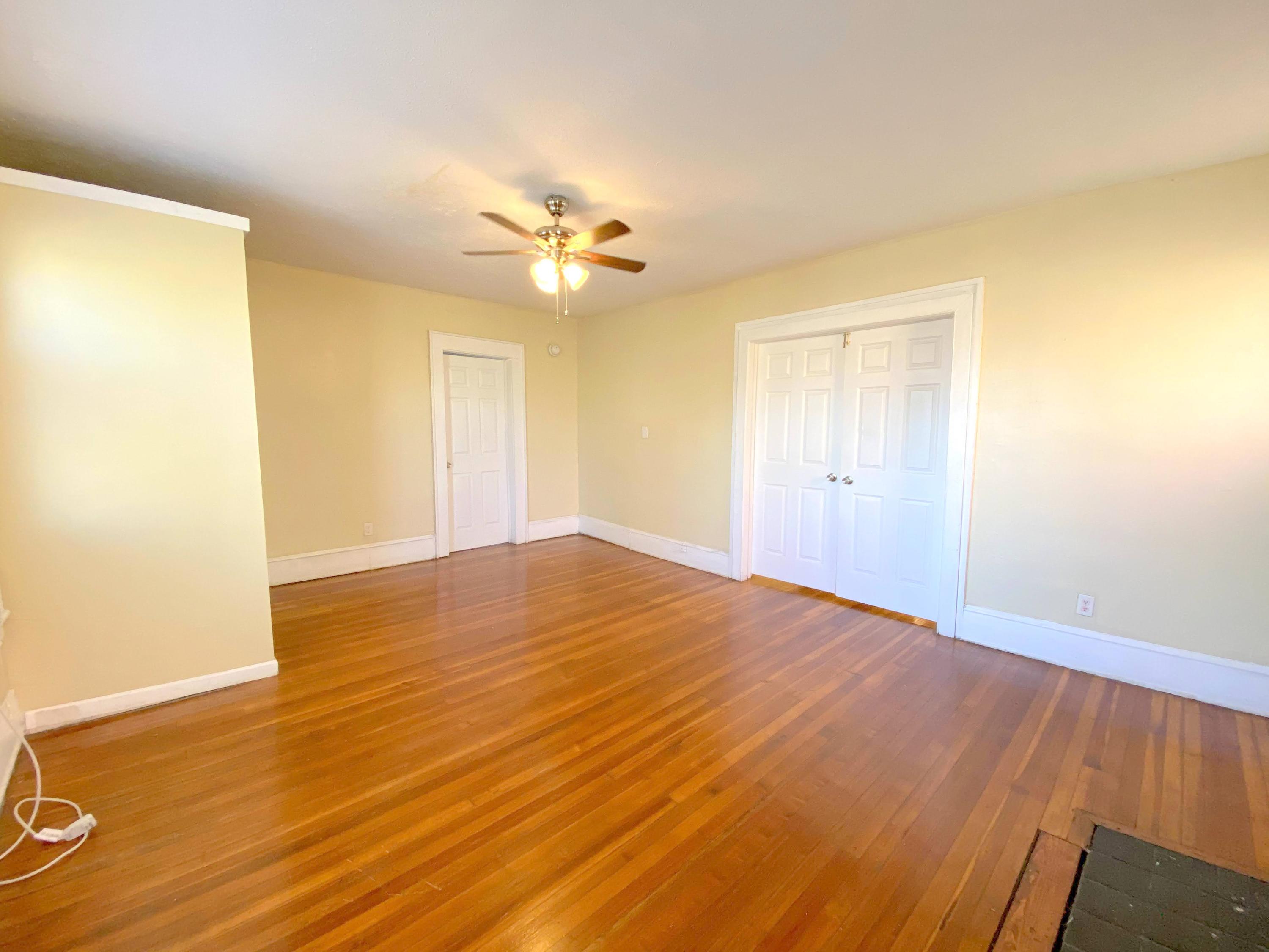1306 Patterson Avenue Southwest, Unit 3 Roanoke, VA 24016 - Photo 22 of 28 a view of empty room with wooden floor and fan