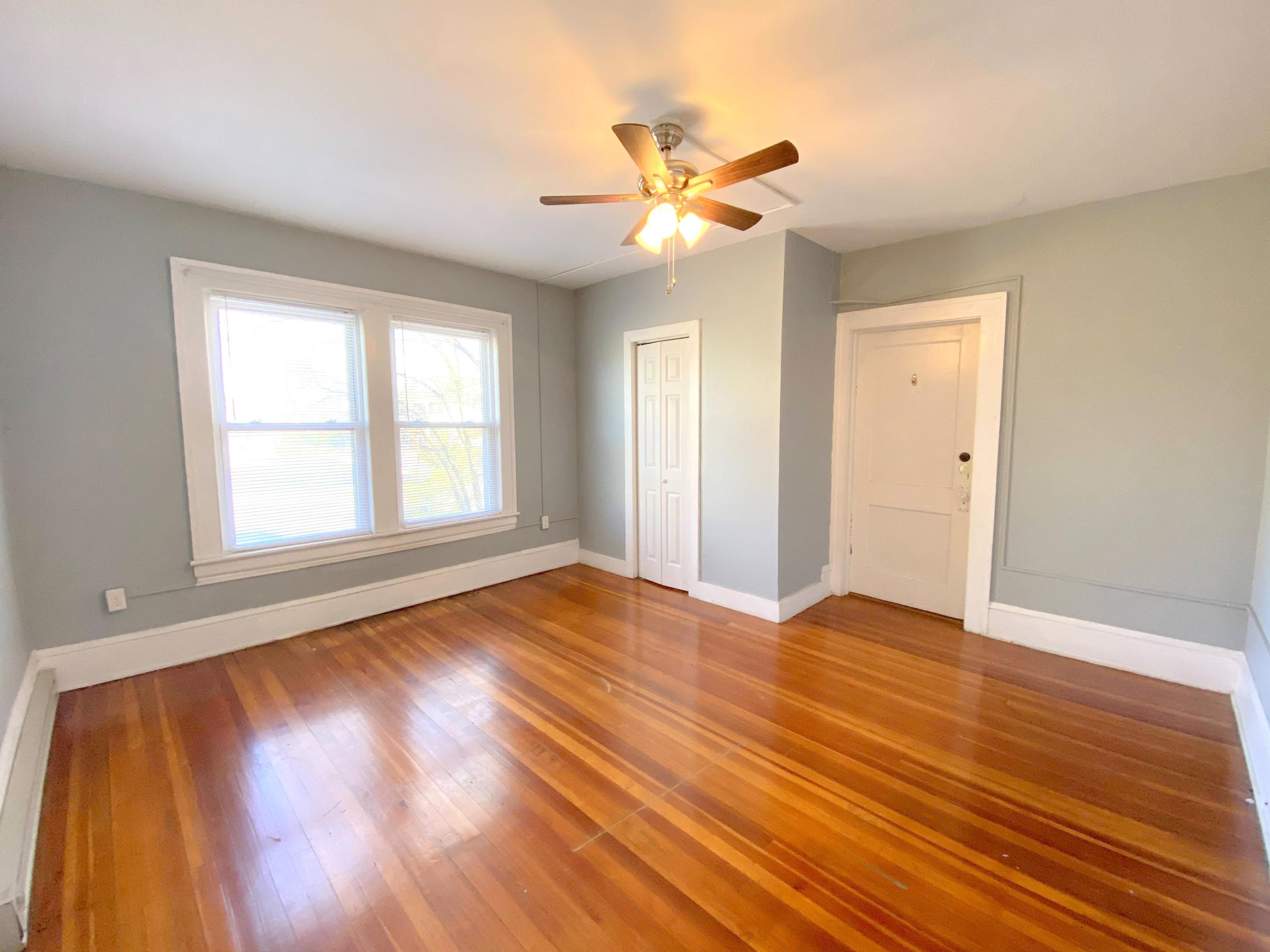 1306 Patterson Avenue Southwest, Unit 3 Roanoke, VA 24016 - Photo 23 of 28 a view of an empty room with wooden floor and a window