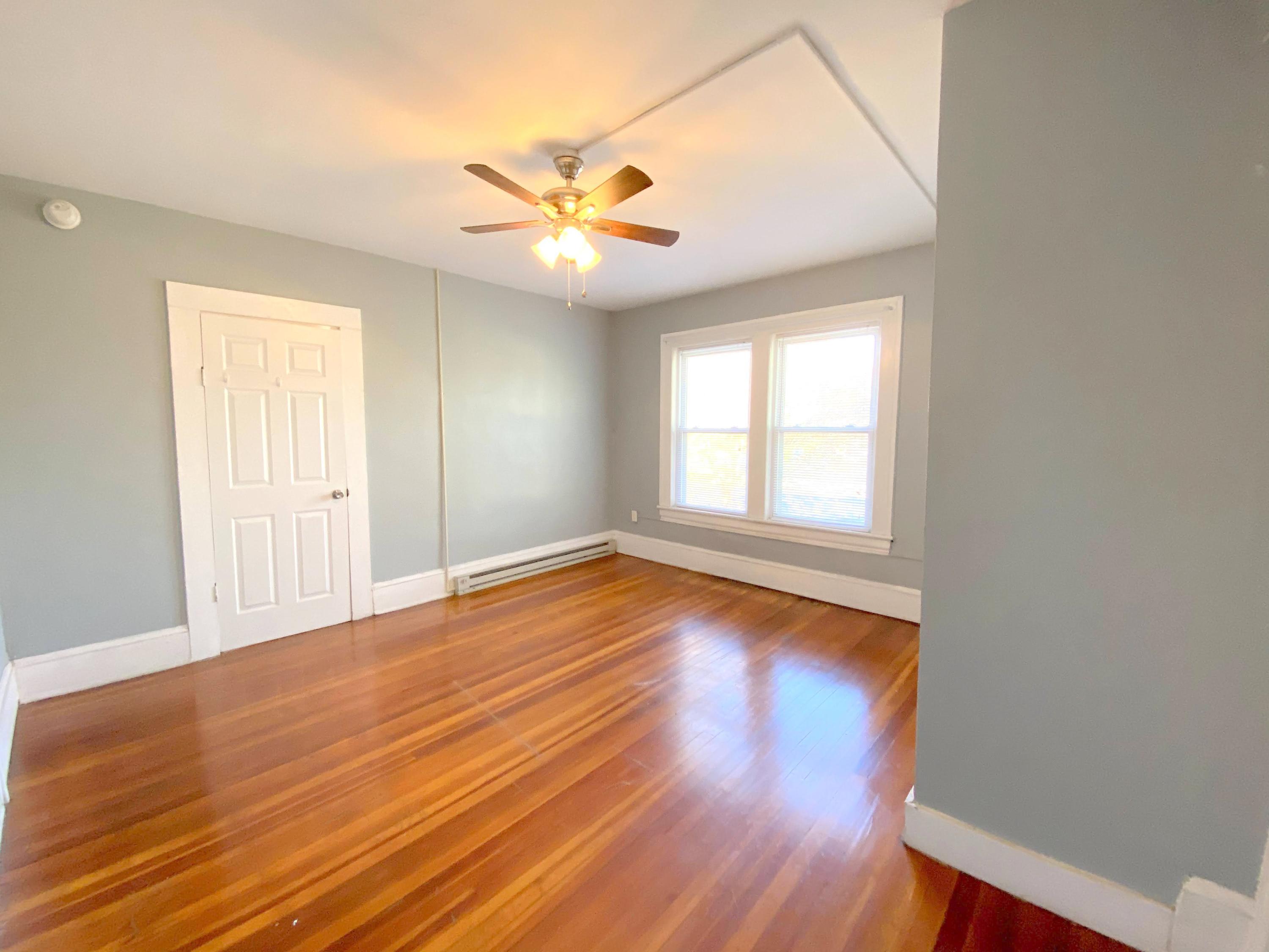 1306 Patterson Avenue Southwest, Unit 3 Roanoke, VA 24016 - Photo 24 of 28 a view of empty room with wooden floor and fan