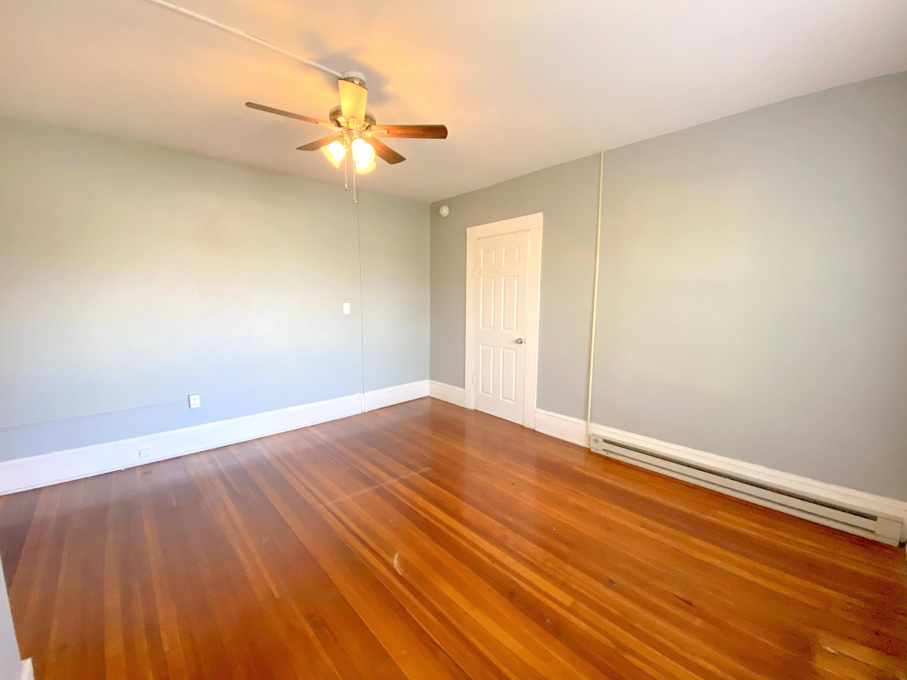 1306 Patterson Avenue Southwest, Unit 3 Roanoke, VA 24016 - Photo 25 of 28 a view of an empty room with wooden floor