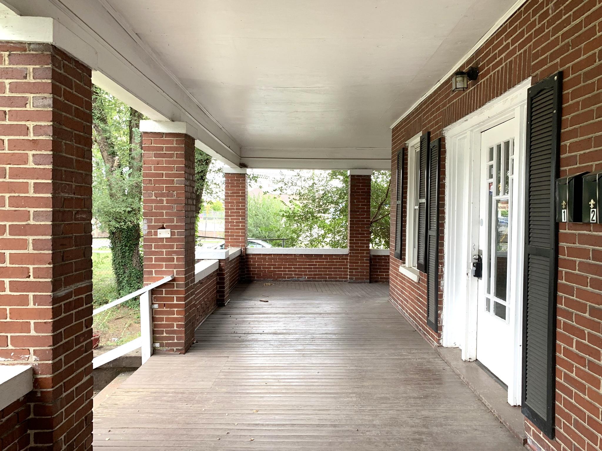 1306 Patterson Avenue Southwest, Unit 3 Roanoke, VA 24016 - Photo 3 of 28 a view of a large room with wooden floor and windows