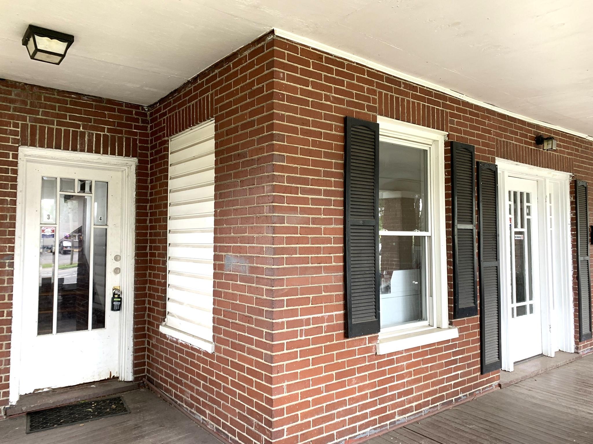 1306 Patterson Avenue Southwest, Unit 3 Roanoke, VA 24016 - Photo 5 of 28 a view of a brick house with a large window