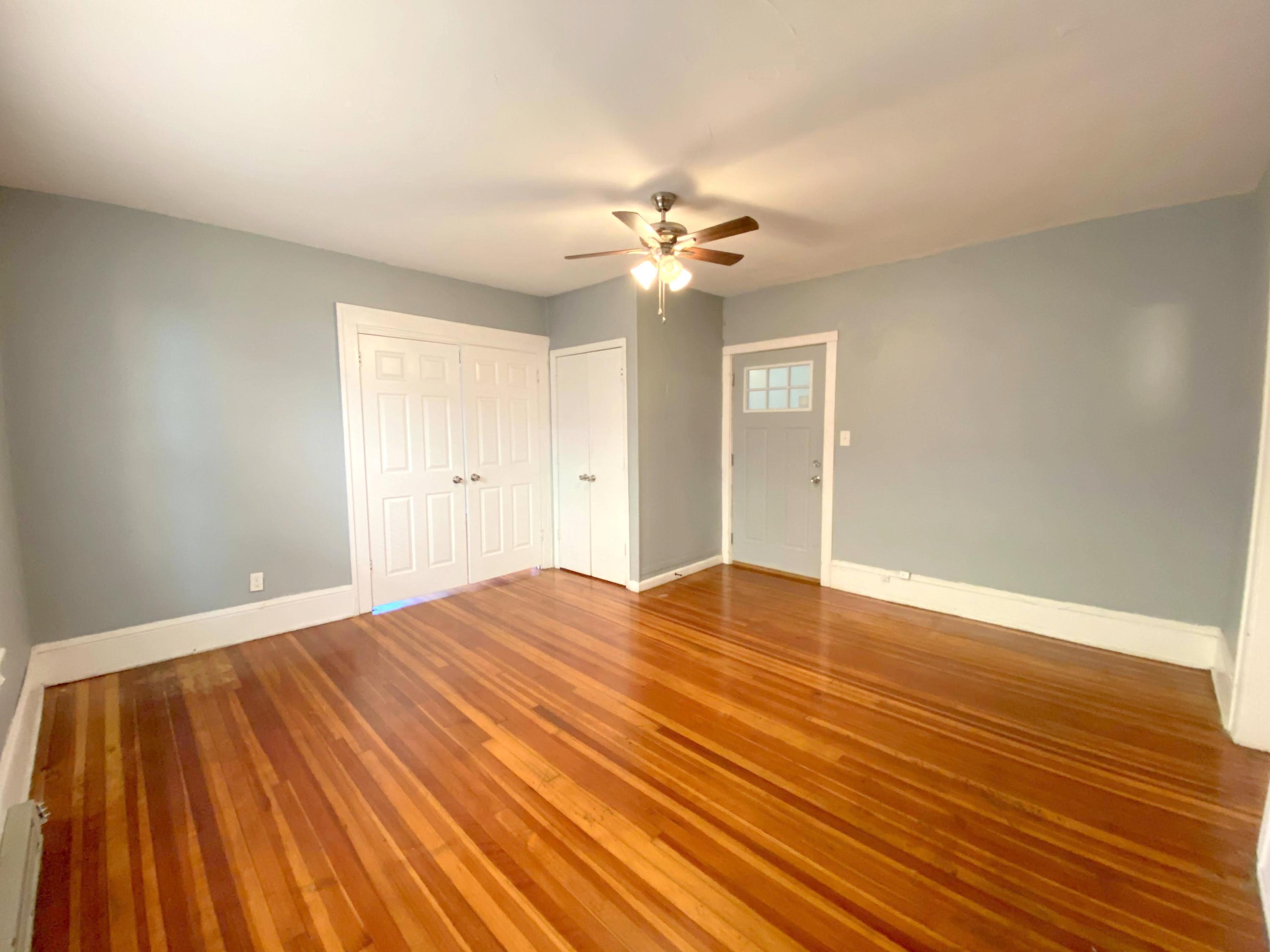1306 Patterson Avenue Southwest, Unit 3 Roanoke, VA 24016 - Photo 8 of 28 a view of empty room with wooden floor and fan