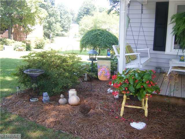 7701 Broad Street Rural Hall, NC 27045 - Photo 3 of 16 Exterior Front. Landscaping like this all around the house.