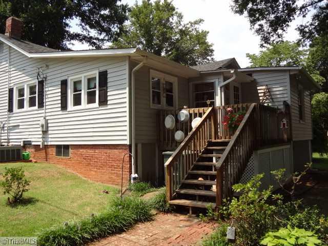 7701 Broad Street Rural Hall, NC 27045 - Photo 4 of 16 Exterior Front. view of deck and entry to basement