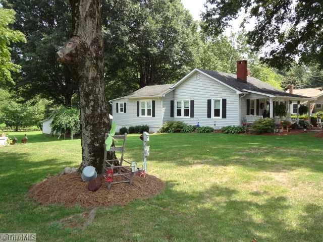 7701 Broad Street Rural Hall, NC 27045 - Photo 5 of 16 Exterior Front. This shot was taken in front left corner. You can see the workshop in the back and also a beautiful well maintained grape vine.