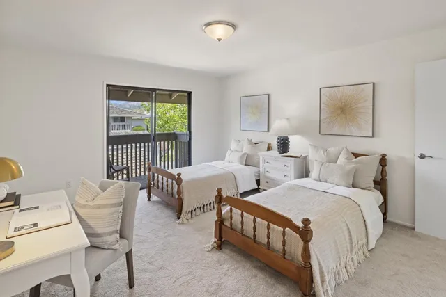 a bedroom with a bed and a lamp