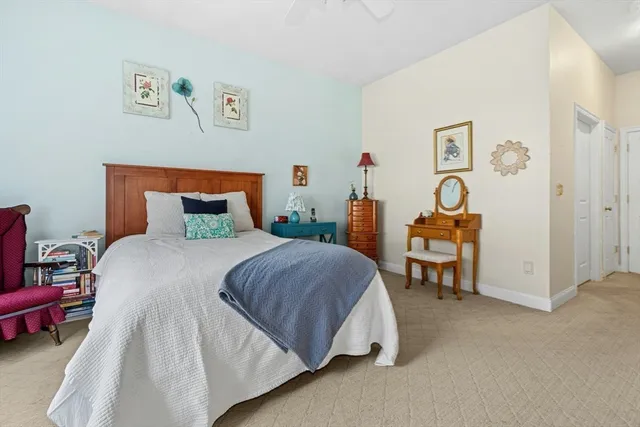 a bedroom with a bed and dresser