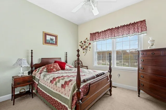 a bedroom with a bed and a table