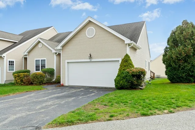 a view of a house with a back yard
