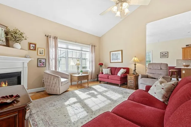 a bedroom with furniture and a fireplace
