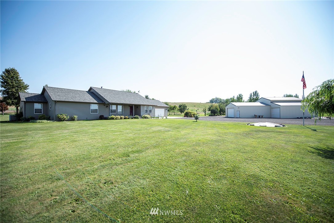 7483 Frog Hollow Road Touchet, WA 99360 - Photo 1 of 25 a house view with a garden space
