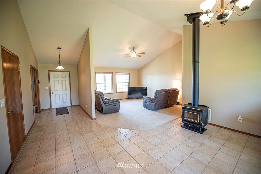 7483 Frog Hollow Road Touchet, WA 99360 - Photo 3 of 25 a living room with furniture and a chandelier