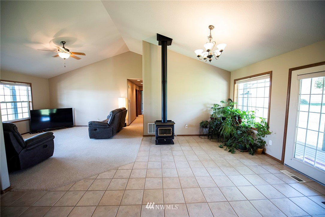7483 Frog Hollow Road Touchet, WA 99360 - Photo 6 of 25 a living room with furniture and a chandelier