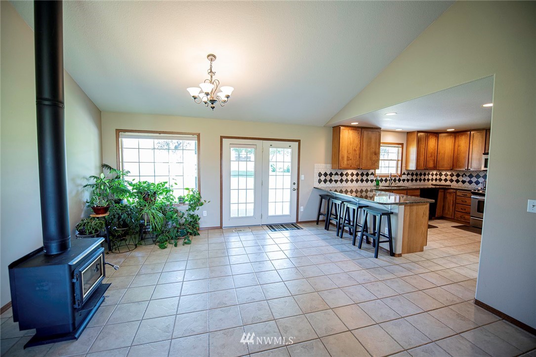 7483 Frog Hollow Road Touchet, WA 99360 - Photo 7 of 25 a large kitchen with a stove and a refrigerator