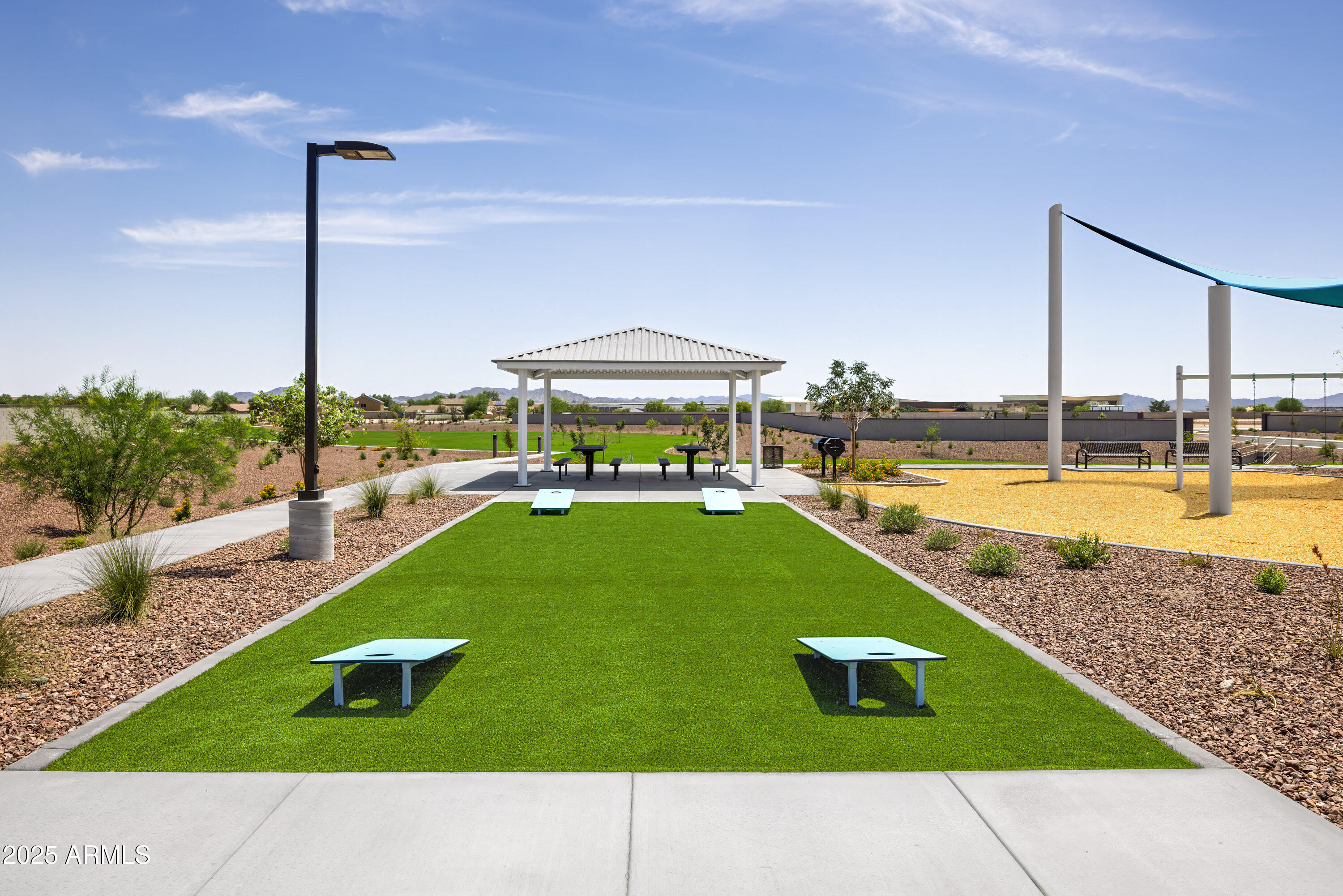 24154 West Carver Road Buckeye, AZ 85326 - Photo 44 of 54 a swimming pool with outdoor seating and yard