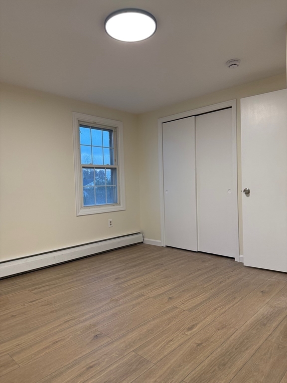 17 Horace Street, Unit 2 Boston, MA 02128 - Photo 11 of 14 a view of an empty room with wooden floor and a window