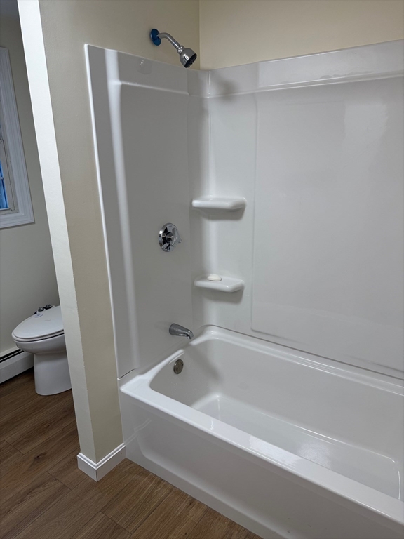 17 Horace Street, Unit 2 Boston, MA 02128 - Photo 12 of 14 a bathroom with a bathtub and a toilet