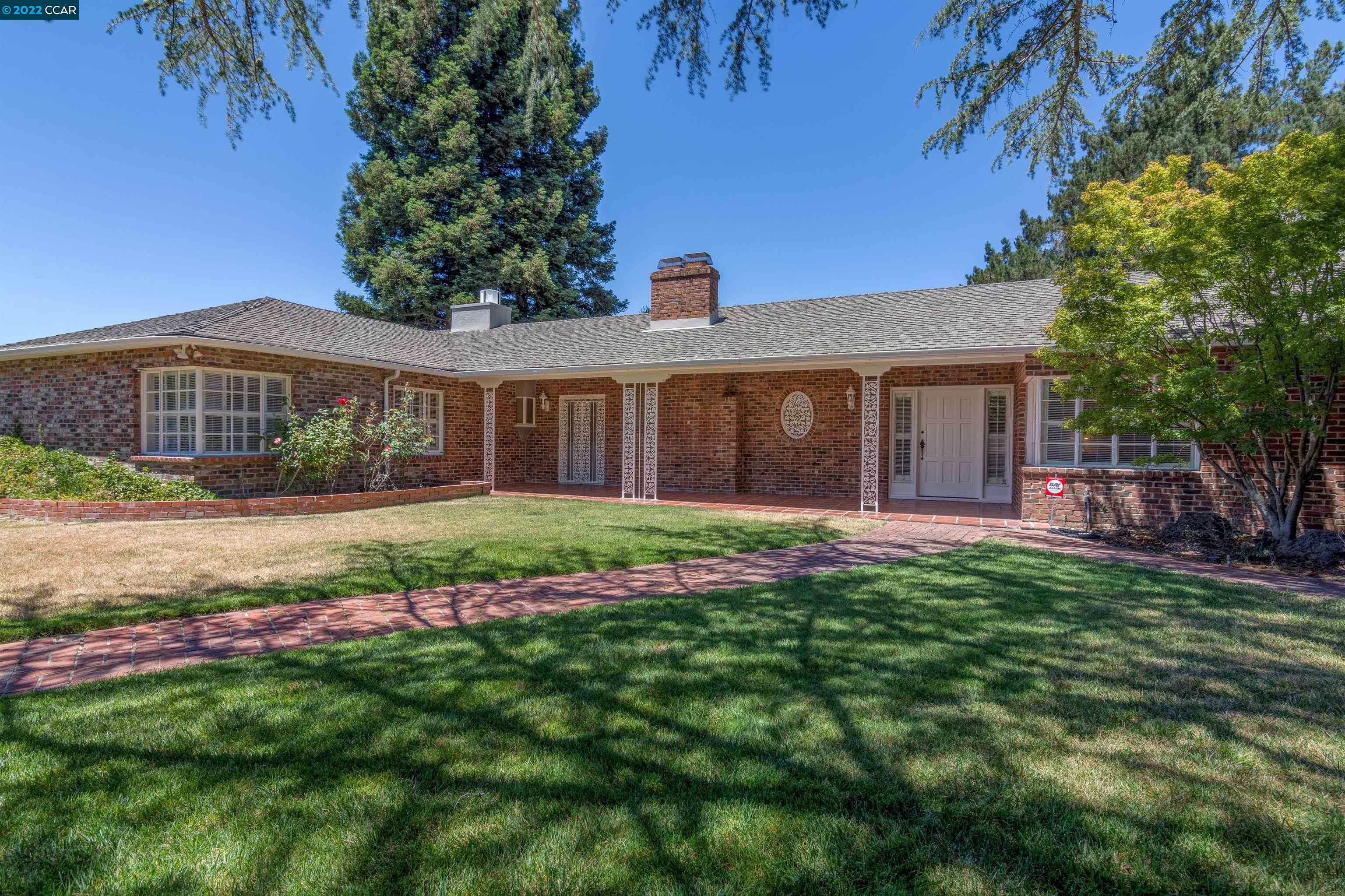 43 Overhill Road Orinda, CA 94563 - Photo 1 of 1 a front view of a house with a yard