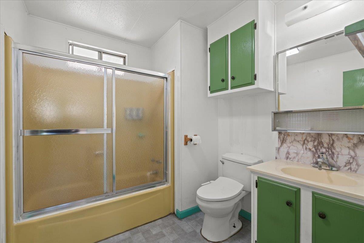 6300 Election Lane, Unit 118 Sacramento, CA 95828 - Photo 14 of 38 a bathroom with a granite countertop sink toilet and shower