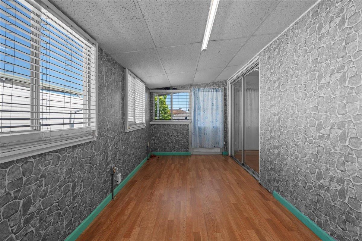 6300 Election Lane, Unit 118 Sacramento, CA 95828 - Photo 19 of 38 a view of hallway with wooden floor and staircase