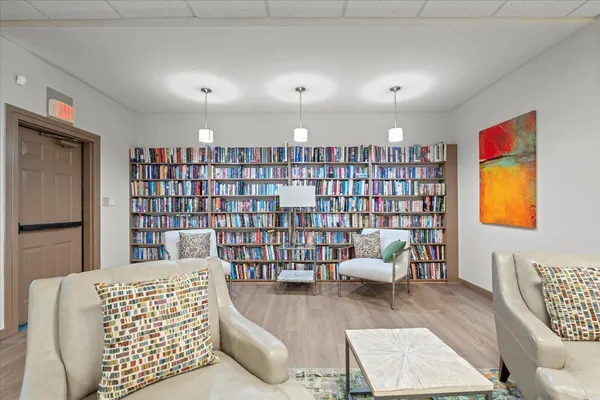 a living room with furniture and white walls