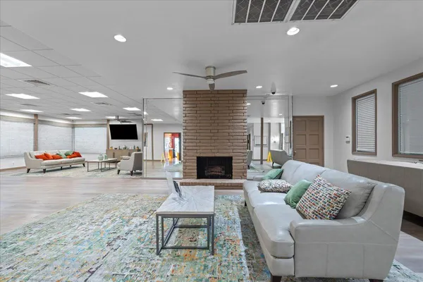 a living room with furniture and a fireplace