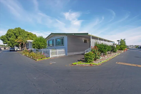 a view of a house with a street