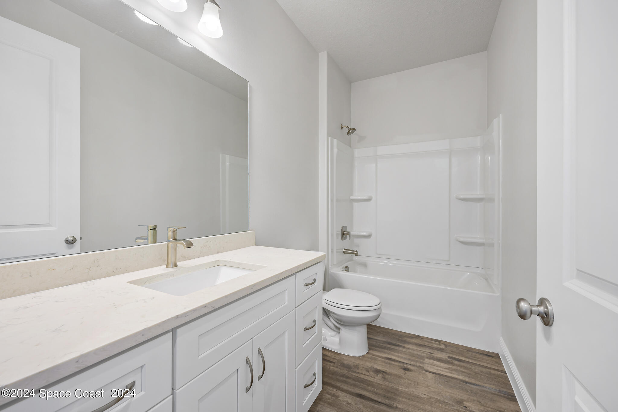 1368 Rabbit Street Southeast Palm Bay, FL 32909 - Photo 21 of 31 a bathroom with a sink a toilet and shower