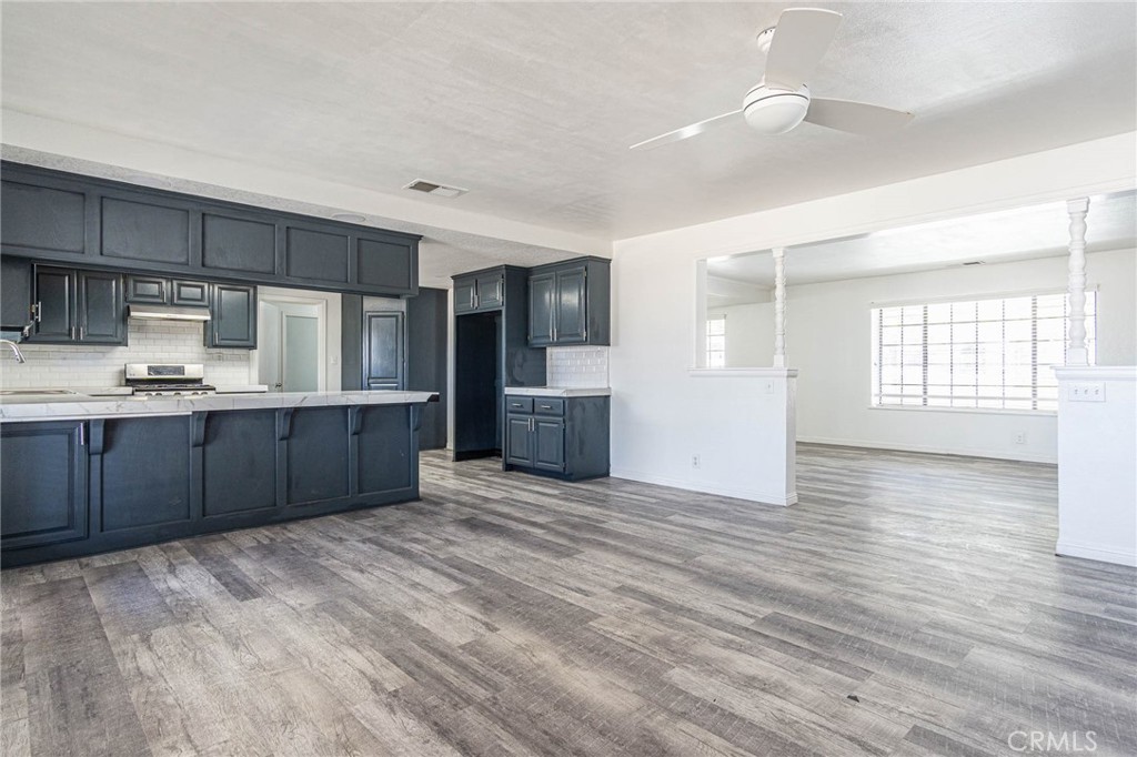 13114 Choco Road Apple Valley, CA 92308 - Photo 16 of 75 a view of kitchen with wooden floor