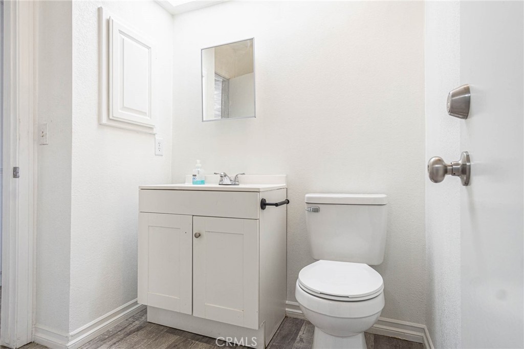 13114 Choco Road Apple Valley, CA 92308 - Photo 26 of 75 a bathroom with a sink toilet and vanity