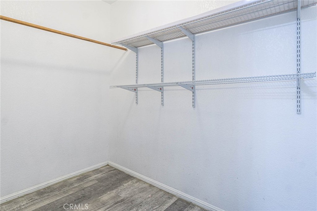 13114 Choco Road Apple Valley, CA 92308 - Photo 27 of 75 a view of a room with racks on the wall