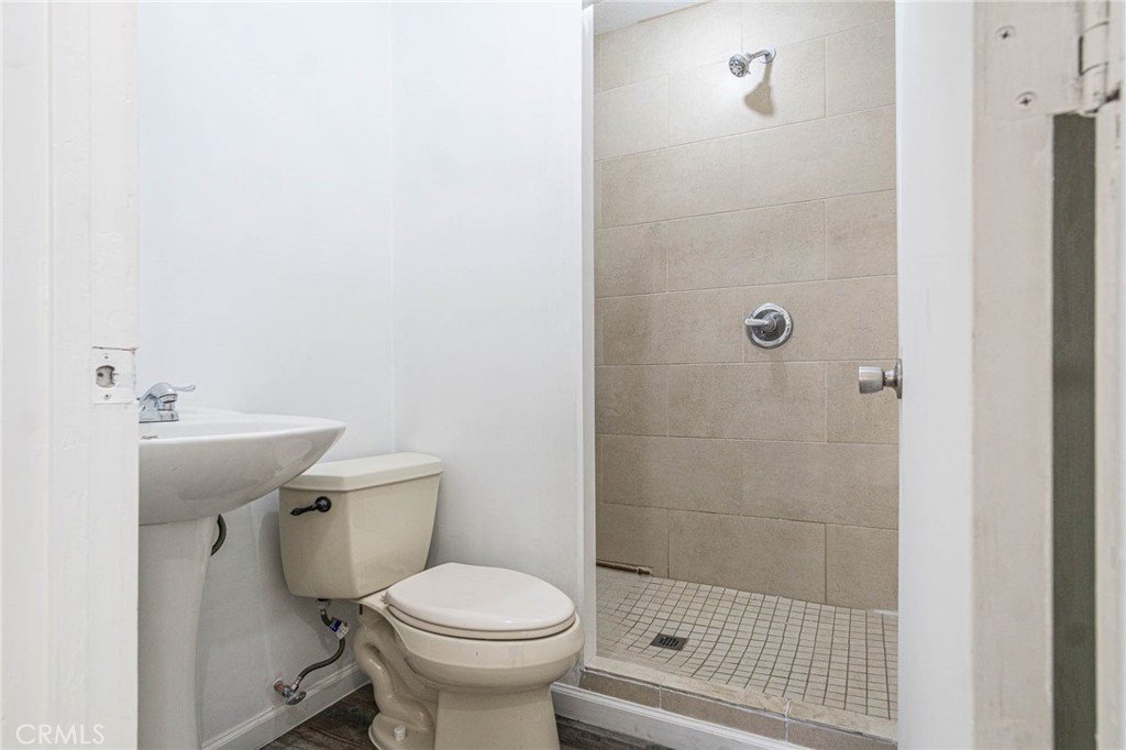 13114 Choco Road Apple Valley, CA 92308 - Photo 35 of 75 a bathroom with a toilet and a shower