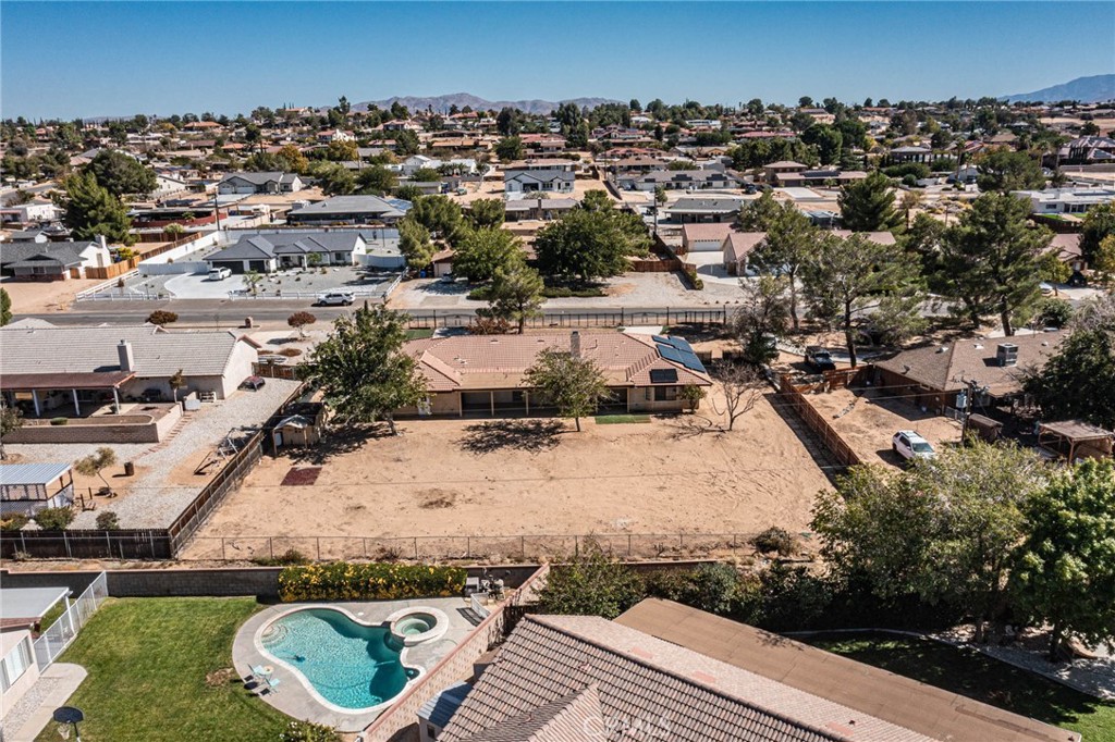 13114 Choco Road Apple Valley, CA 92308 - Photo 67 of 75 an aerial view of a house with a yard and lake view