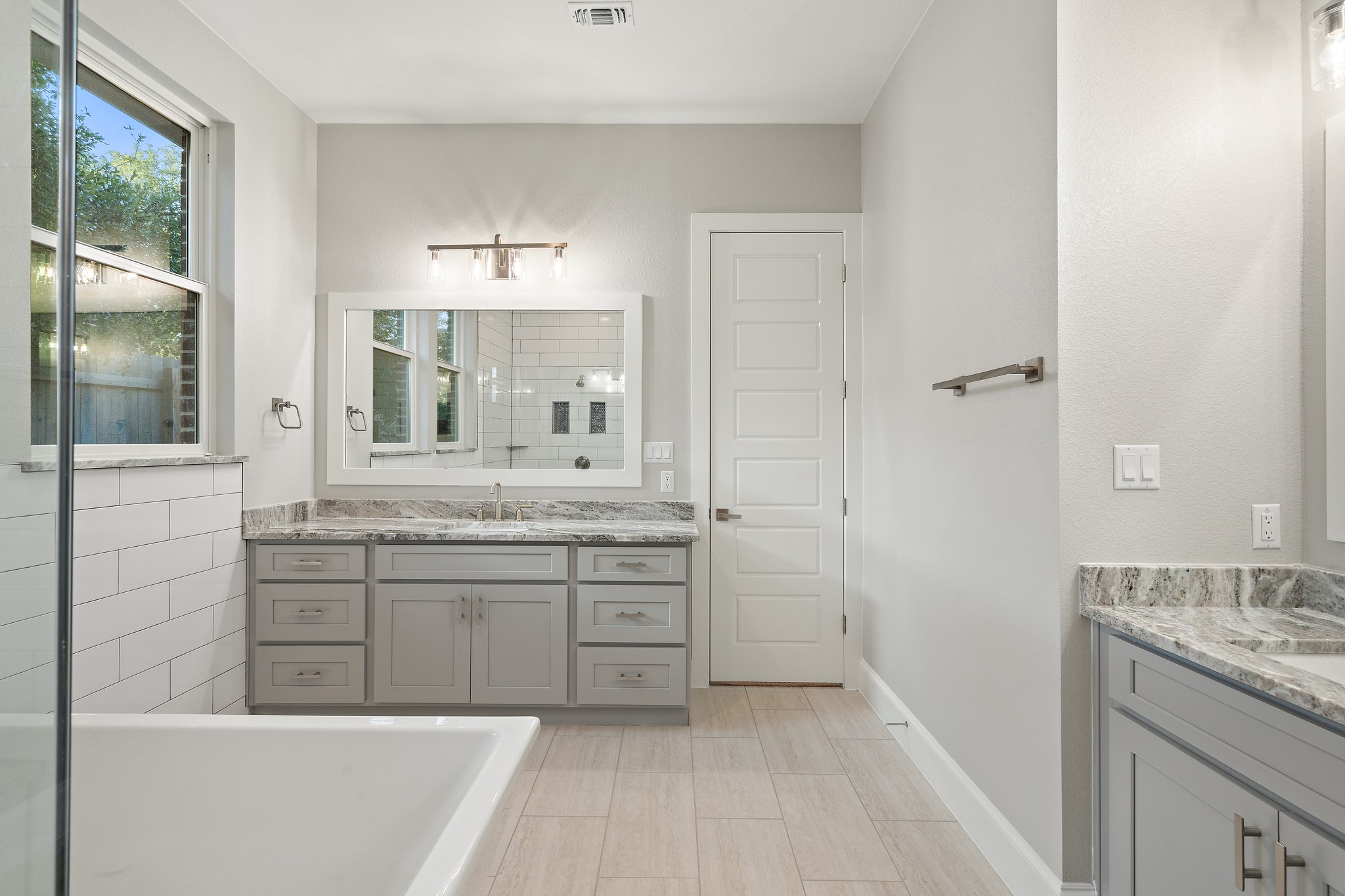 112 Axis Loop Georgetown, TX 78628 - Photo 24 of 39 a bathroom with a granite countertop sink mirror and a