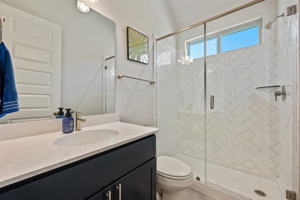686 Treadwell Lane Kyle, TX 78640 - Photo 30 of 40 a bathroom with a sink and a mirror