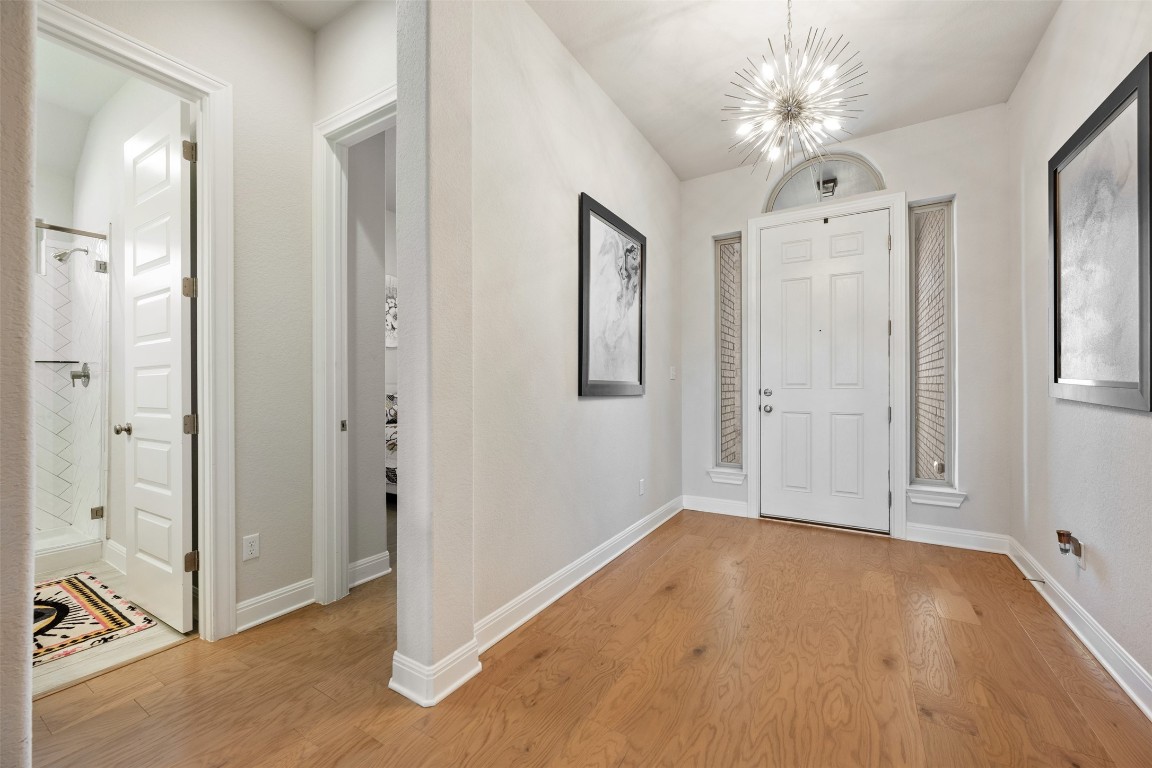686 Treadwell Lane Kyle, TX 78640 - Photo 3 of 40 a view of a livingroom with a chandelier