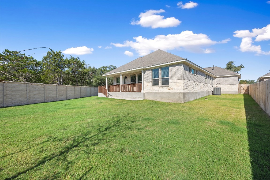 686 Treadwell Lane Kyle, TX 78640 - Photo 36 of 40 a view of a house with a backyard