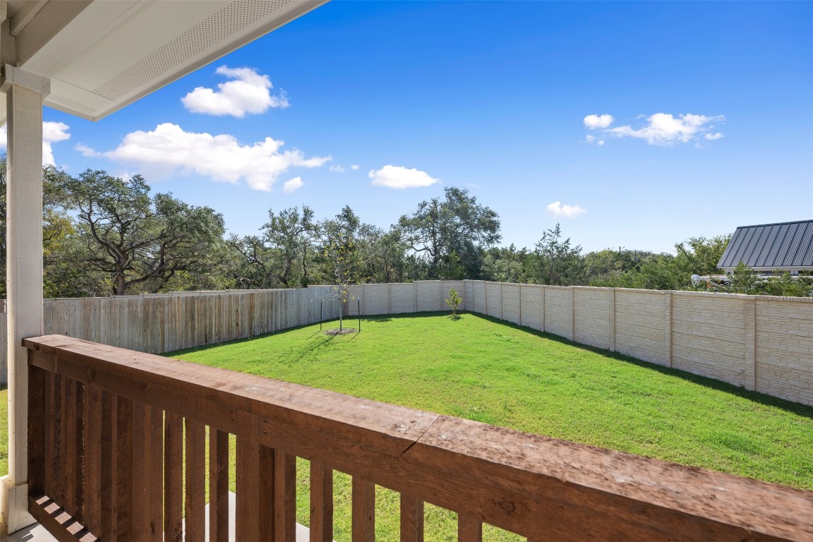 686 Treadwell Lane Kyle, TX 78640 - Photo 37 of 40 a view of a backyard with a fence