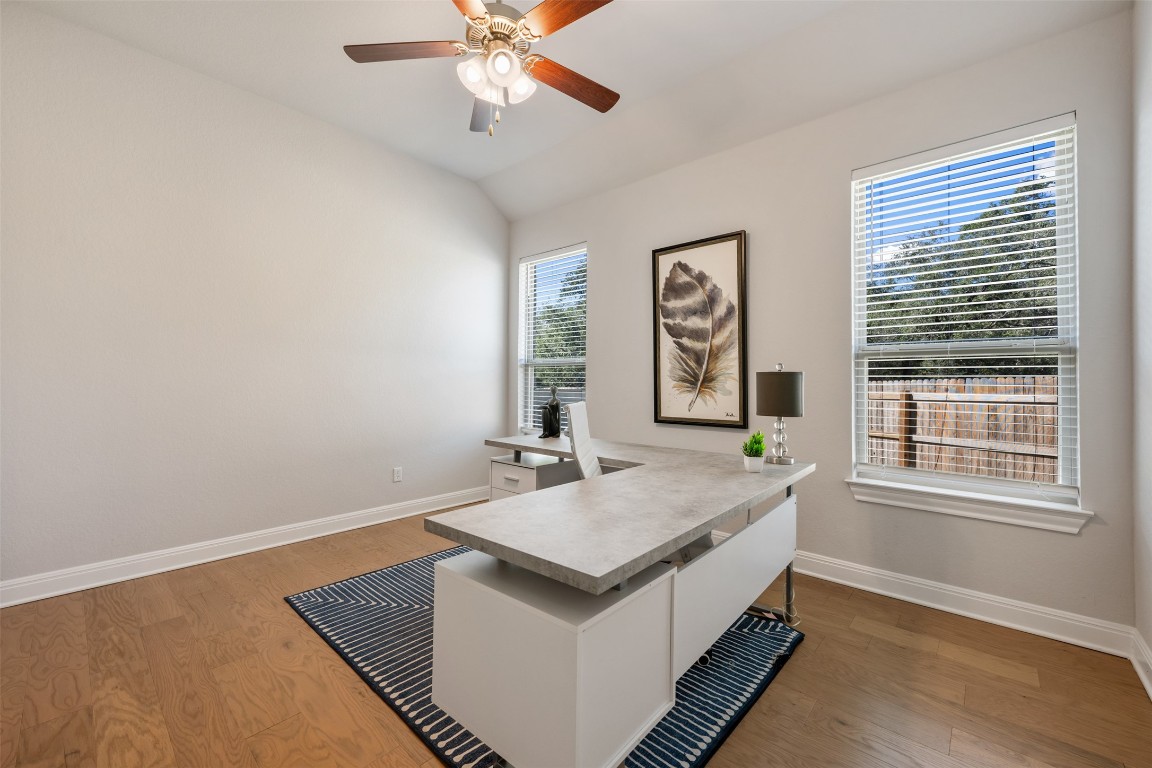 686 Treadwell Lane Kyle, TX 78640 - Photo 6 of 40 a spacious bedroom with a bed and a window