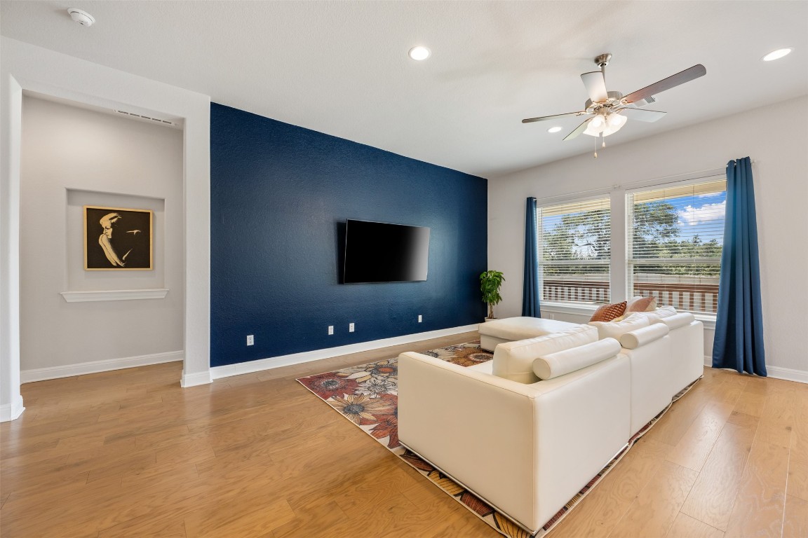 686 Treadwell Lane Kyle, TX 78640 - Photo 9 of 40 a living room with furniture and a flat screen tv
